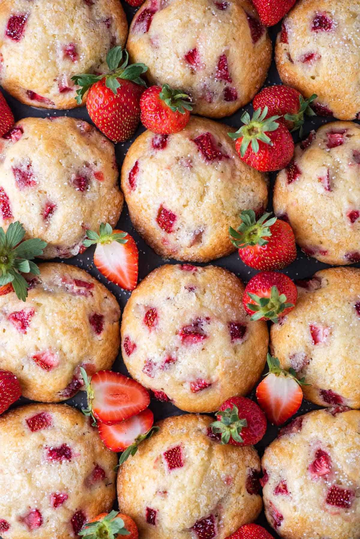 strawberry muffins arranged with fresh strawberries in between