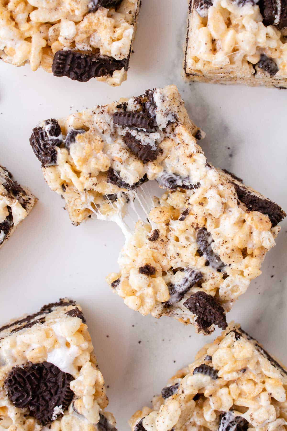 a pulled apart oreo rice krispie treat surrounded by more oreo rice krispies