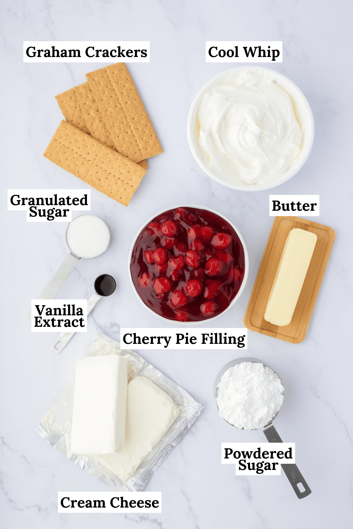 the ingredients for a cherry delight recipe including graham crackers, cool whip, sugar, cherry pie filling, butter, vanilla extract, powdered sugar and cream cheese