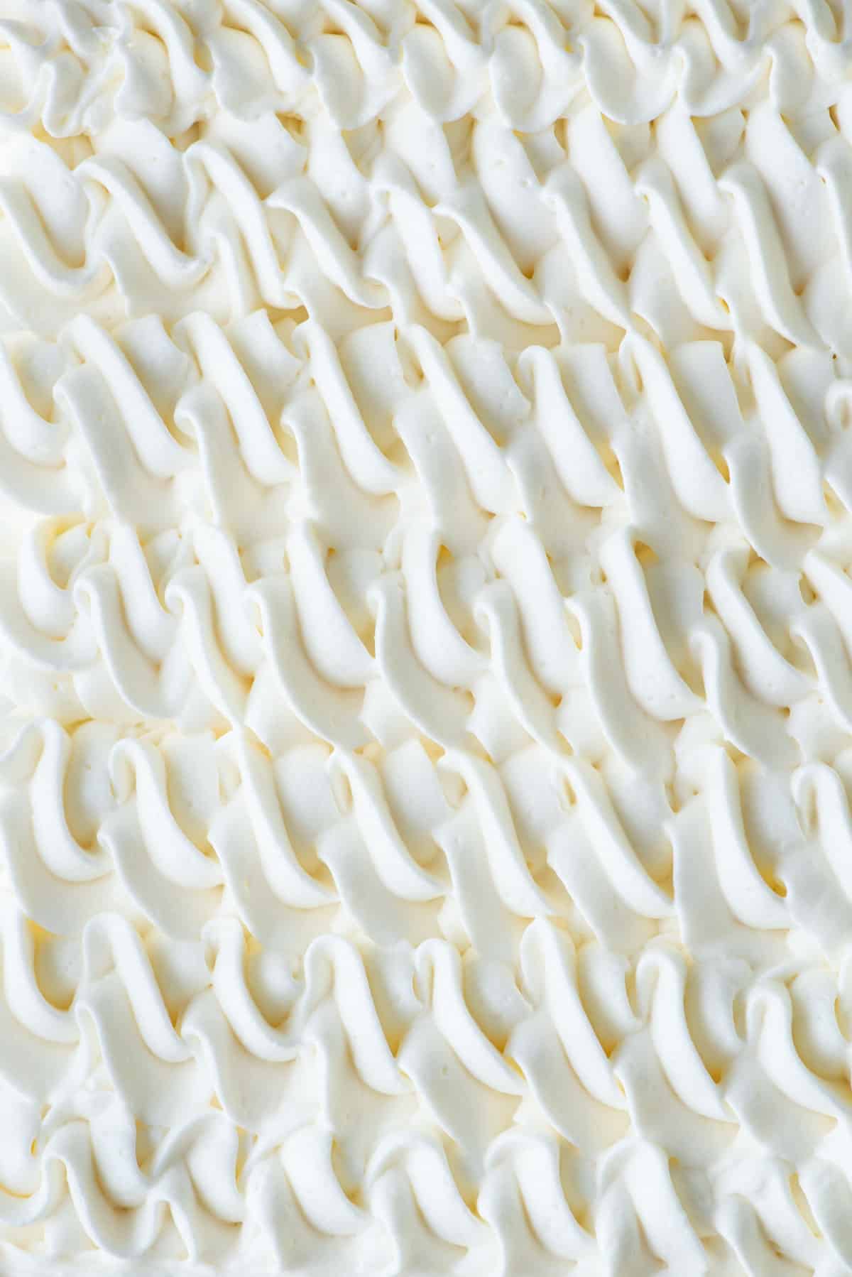 stabilized whipped cream piped into a pretty pattern