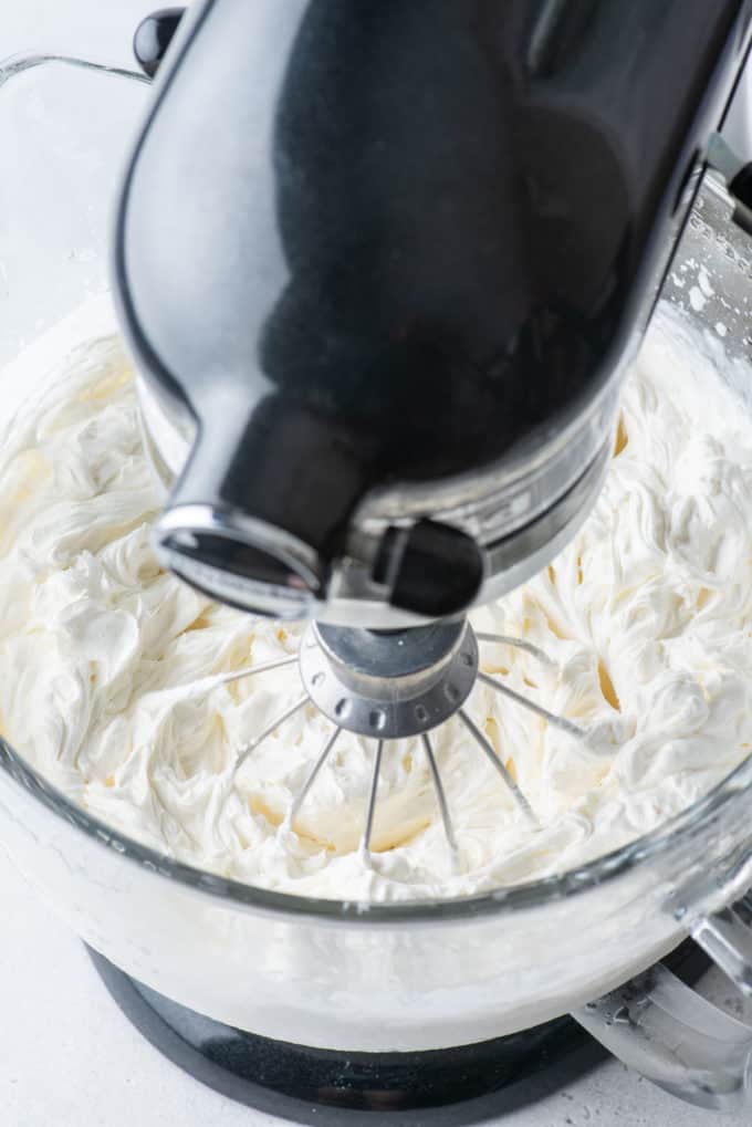 stabilized cream cheese mixed in an electric mixer