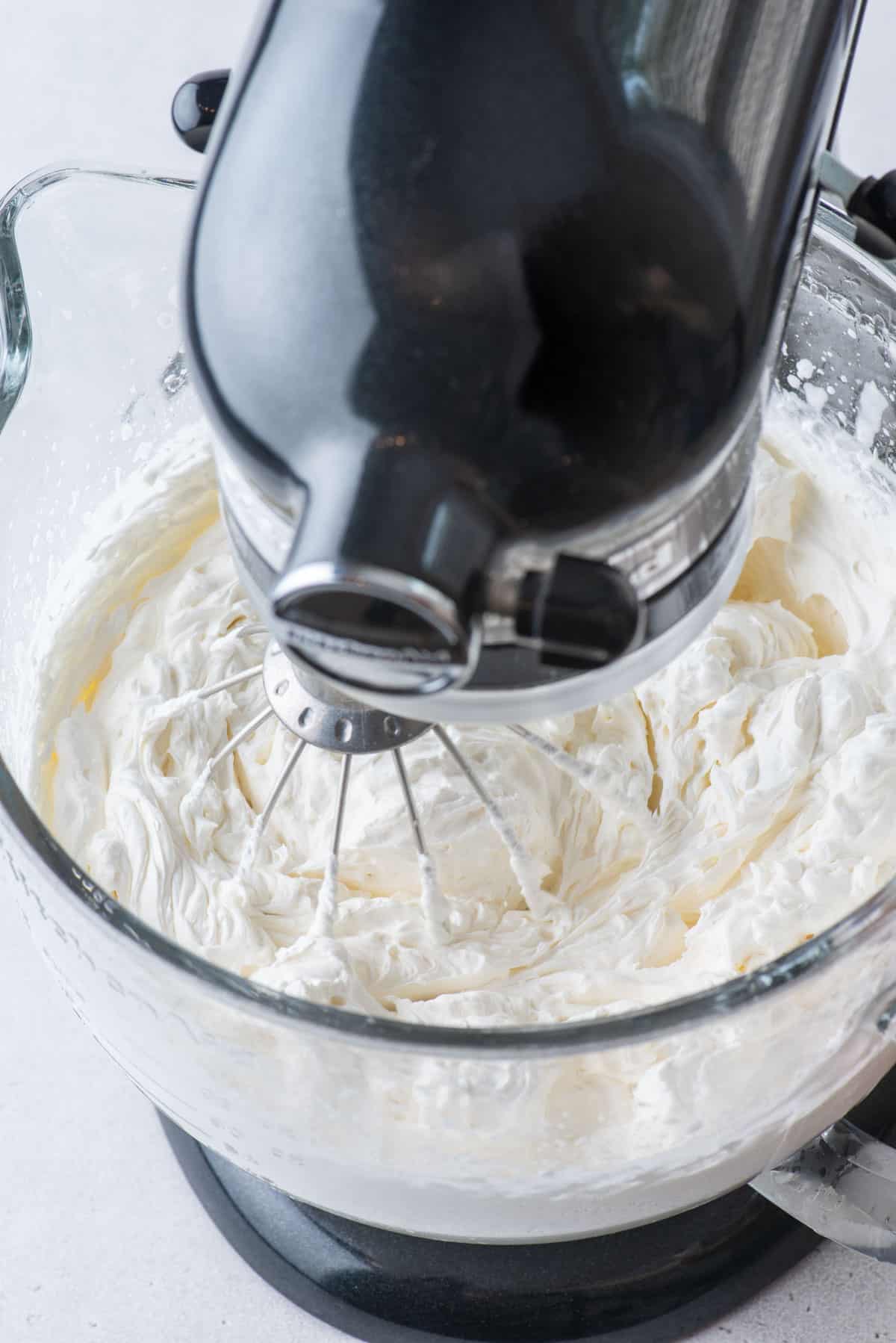 homemade whipped cream in an electric stand mixer bowl