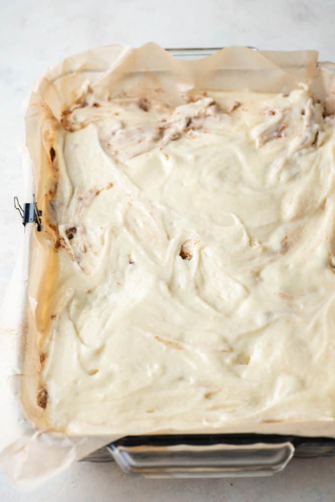 coffee cake batter in a baking pan lined with parchment paper