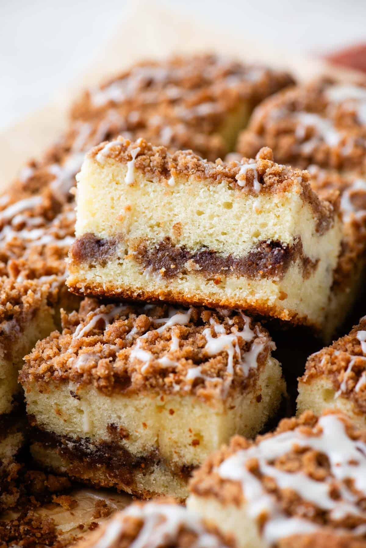coffee cake slices arrange around each other with one stacked partially slanted on top of another and more all around