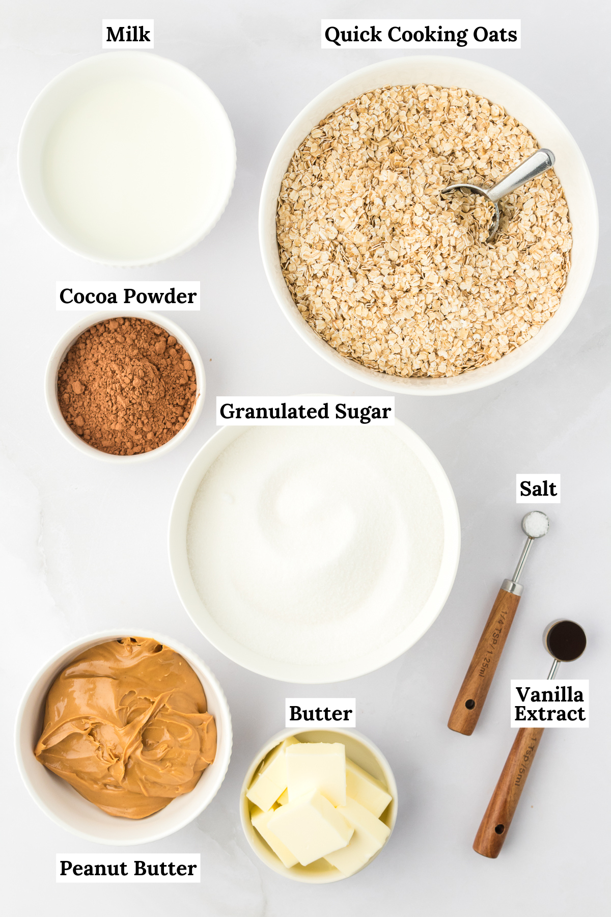 ingredients for no bake cookies including milk, quick cooking oats, cocoa powder, granulated sugar, salt, vanilla extract, butter, and peanut butter