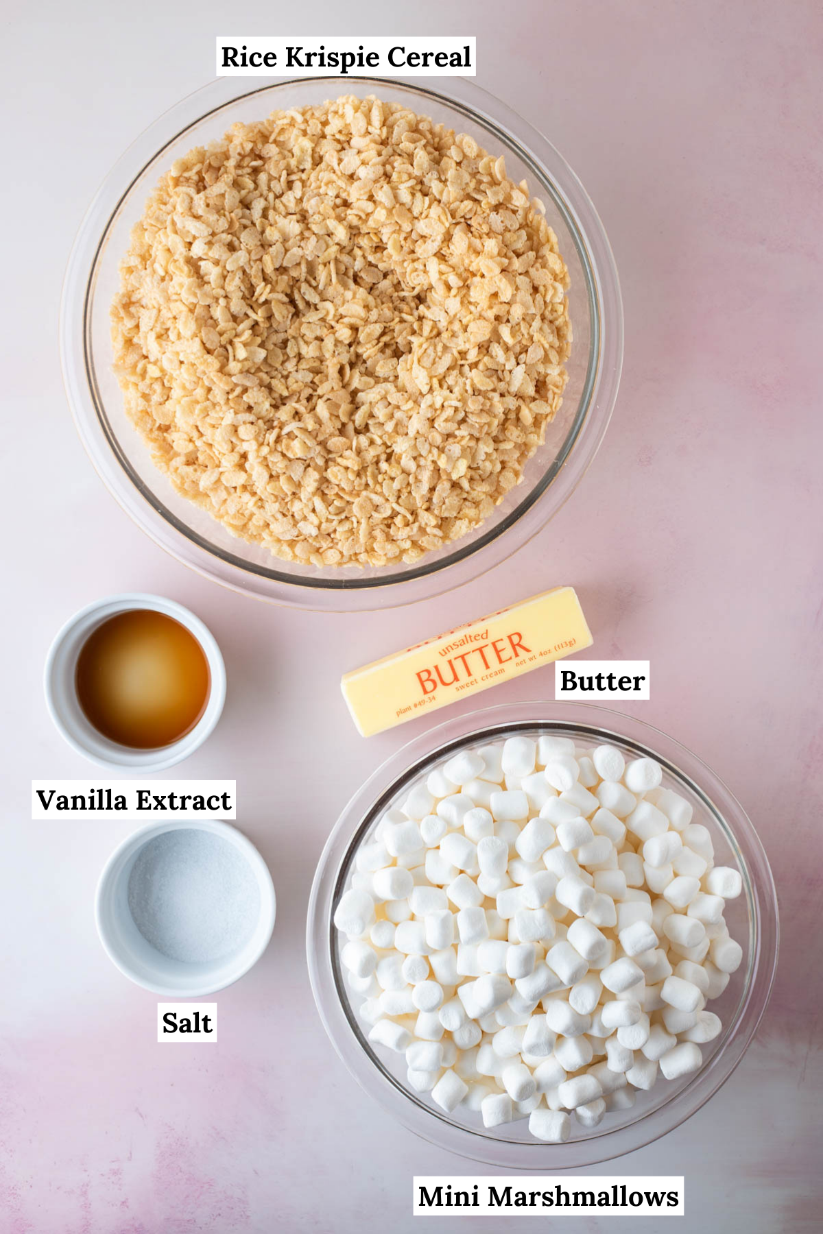 ingredients for rice krispie treats including vanilla extract, butter, salt, mini marshmallows and rice krispie treats