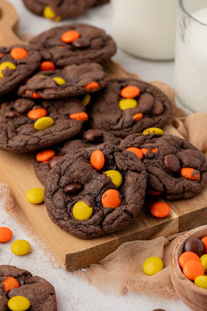 reese's pieces cake mix cookies on a wooden board 