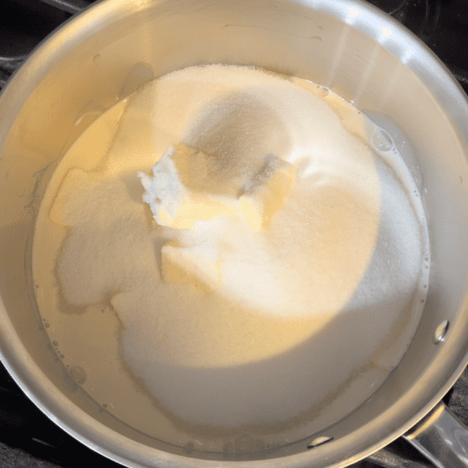sugar, butter and evaporated milk in a pot on a stovetop