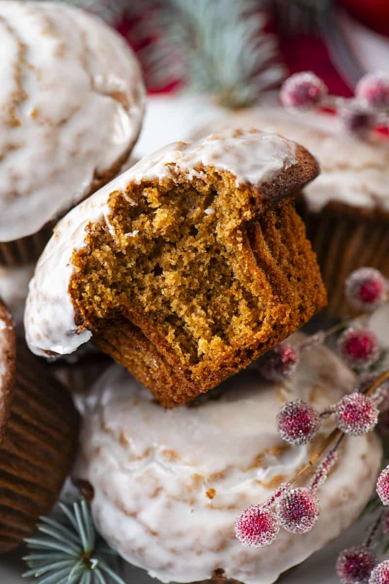 gingerbread muffin with bite removed with sugared red berries 