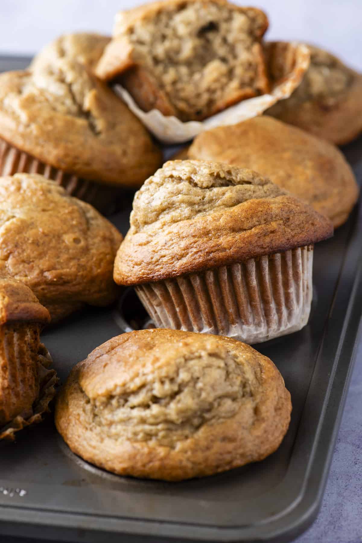 healthy banana muffins arranged in metal muffin pan