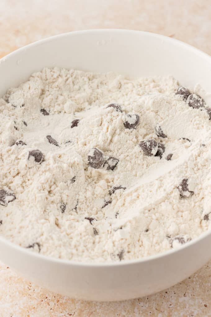 a flour mixture and chocolate chips in a white bowl