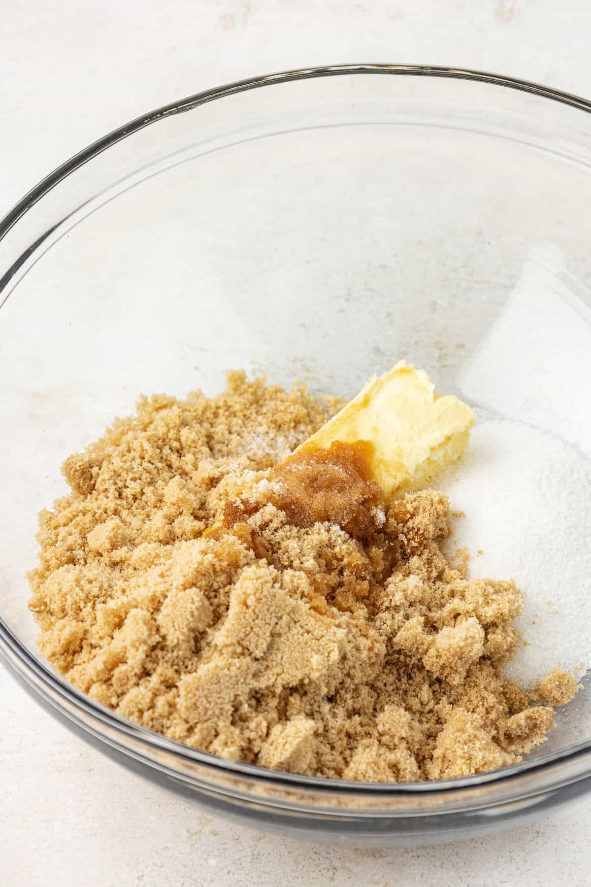 brown sugar, granulated sugar, butter, vanilla extract and salt in a clear glass bowl