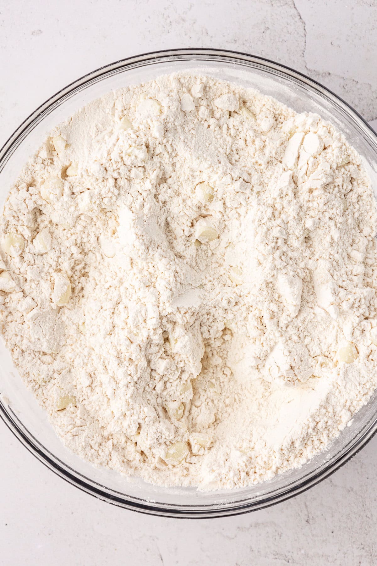 flour mixture for white chocolate chip cookies in a large glass bowl