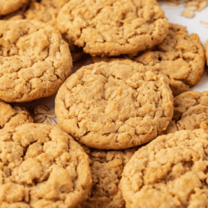 scattered peanut butter oatmeal cookies stacked on each other