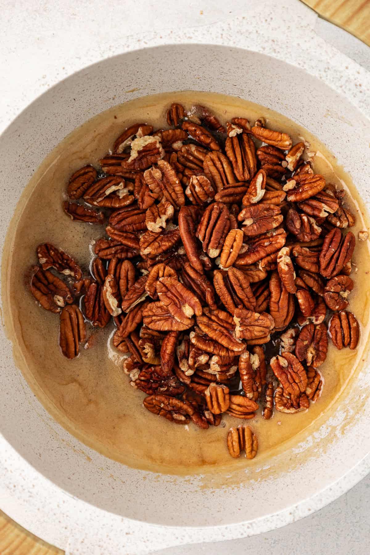 pecan pie filling being cooked in a small saucepan