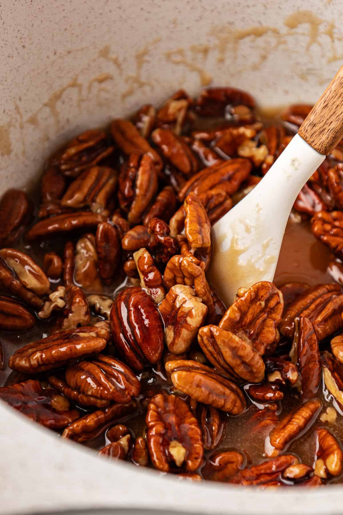 pecan pie filling being mixed in a saucepan