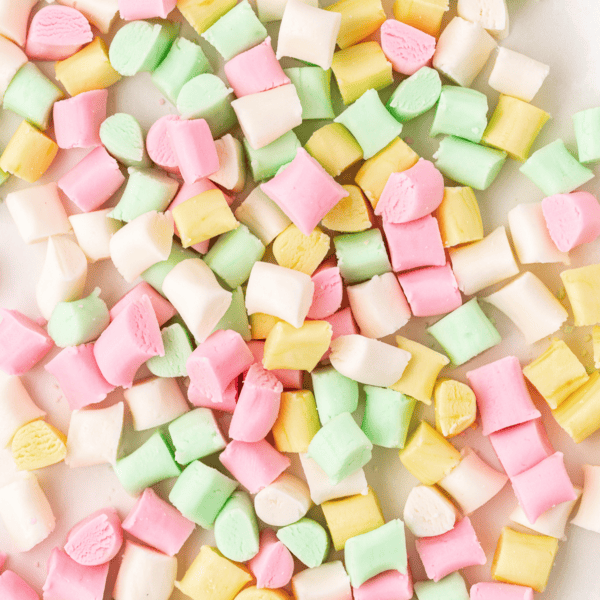 close up of a pile of pink, white, yellow and green butter mints