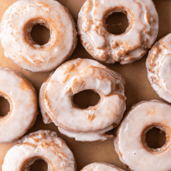 close up of rows of donuts covered in donut glaze