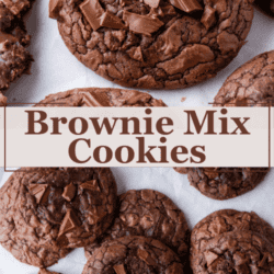 Close-up of chocolate brownie mix cookies with chunks of chocolate on top, displayed on white parchment paper. Text in the center reads Brownie Mix Cookies.