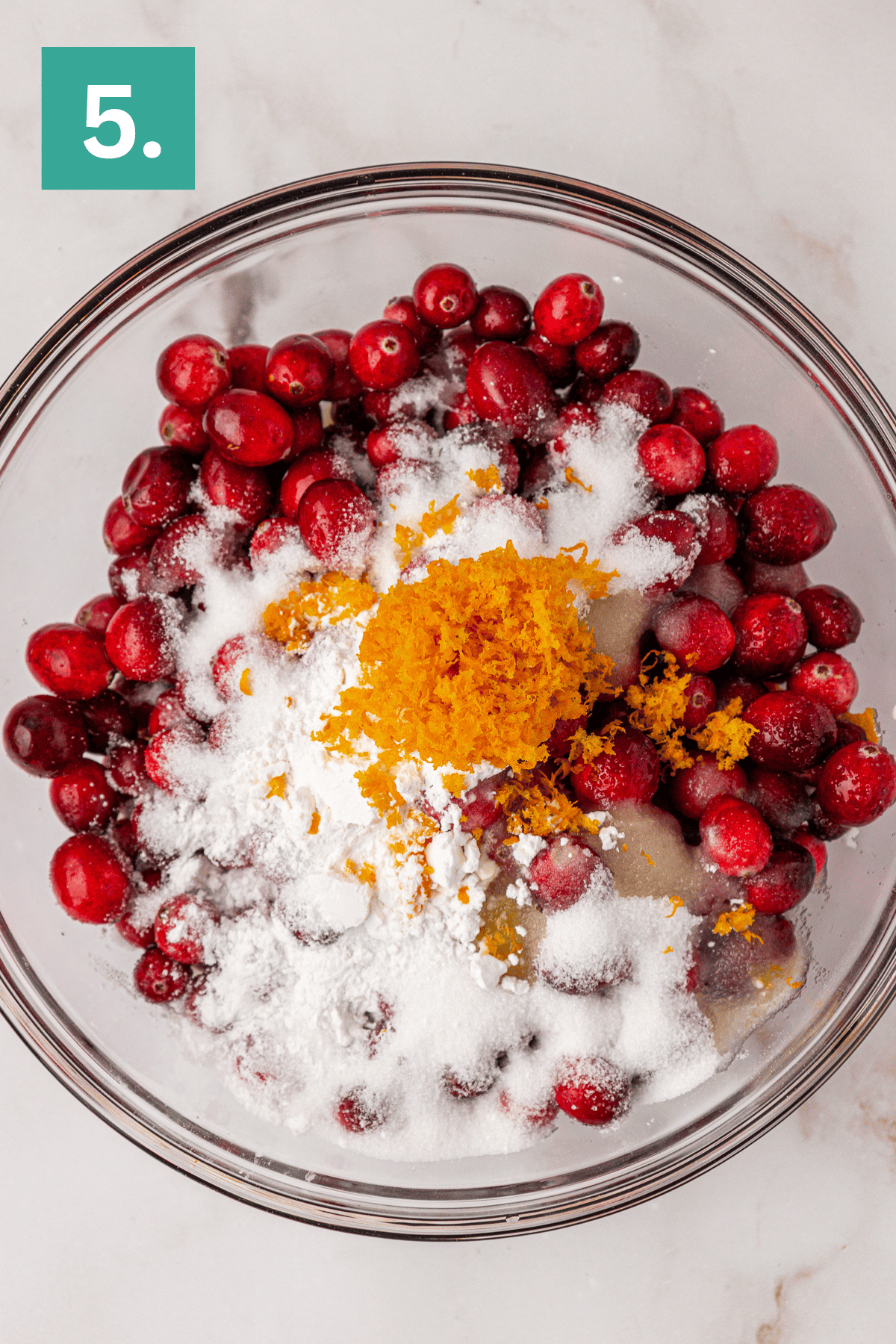 cranberries, granulated sugar, cornstarch, orange zest, and orange juice in a large glass bowl