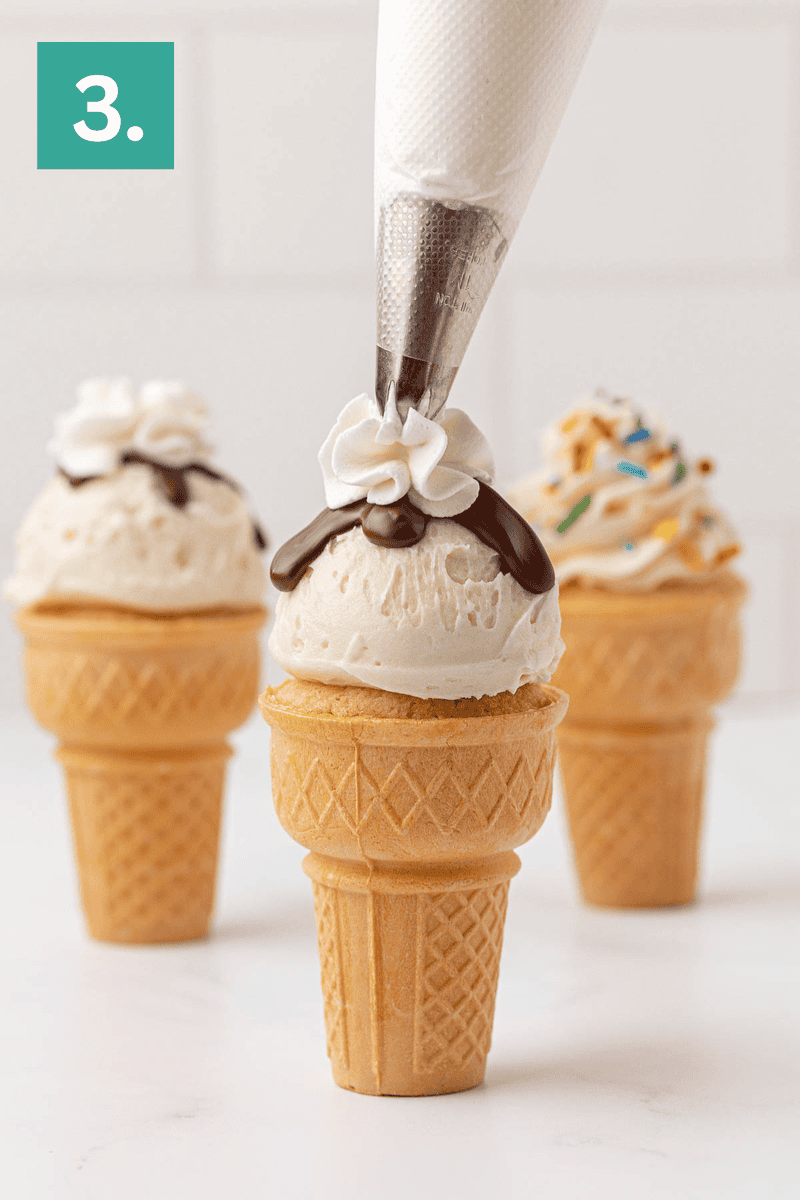 A piping bag adds a swirl of whipped cream to vanilla ice cream in a cone with chocolate topping; two more decorated ice cream cones are in the background. A green box with the number 3 is in the top left corner.