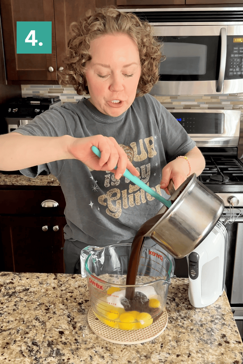 A person pours melted chocolate from a saucepan into a glass measuring cup with eggs, preparing ingredients on a kitchen counter. A step 4 label appears in the top left corner.