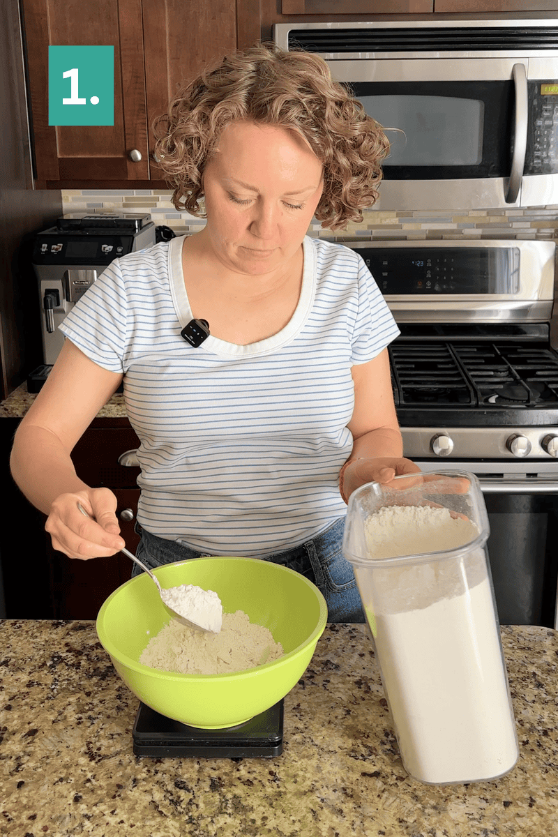 A woman in a striped shirt scoops flour from a container into a green bowl on a kitchen counter, step 1 is shown in a green box in the upper left corner.
